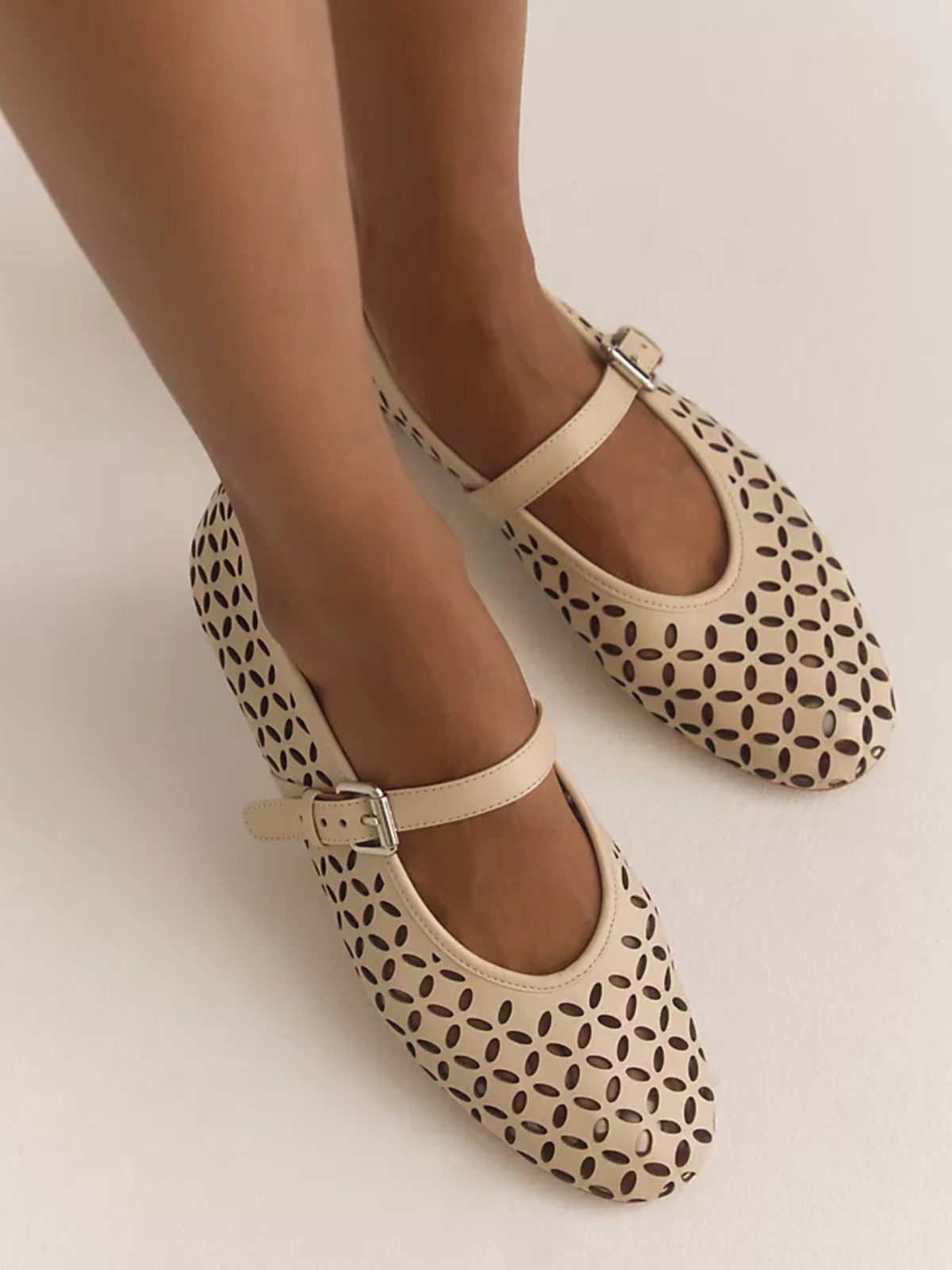 Cream Flats Mary Janes With Floral Cutout And Buckled Strap