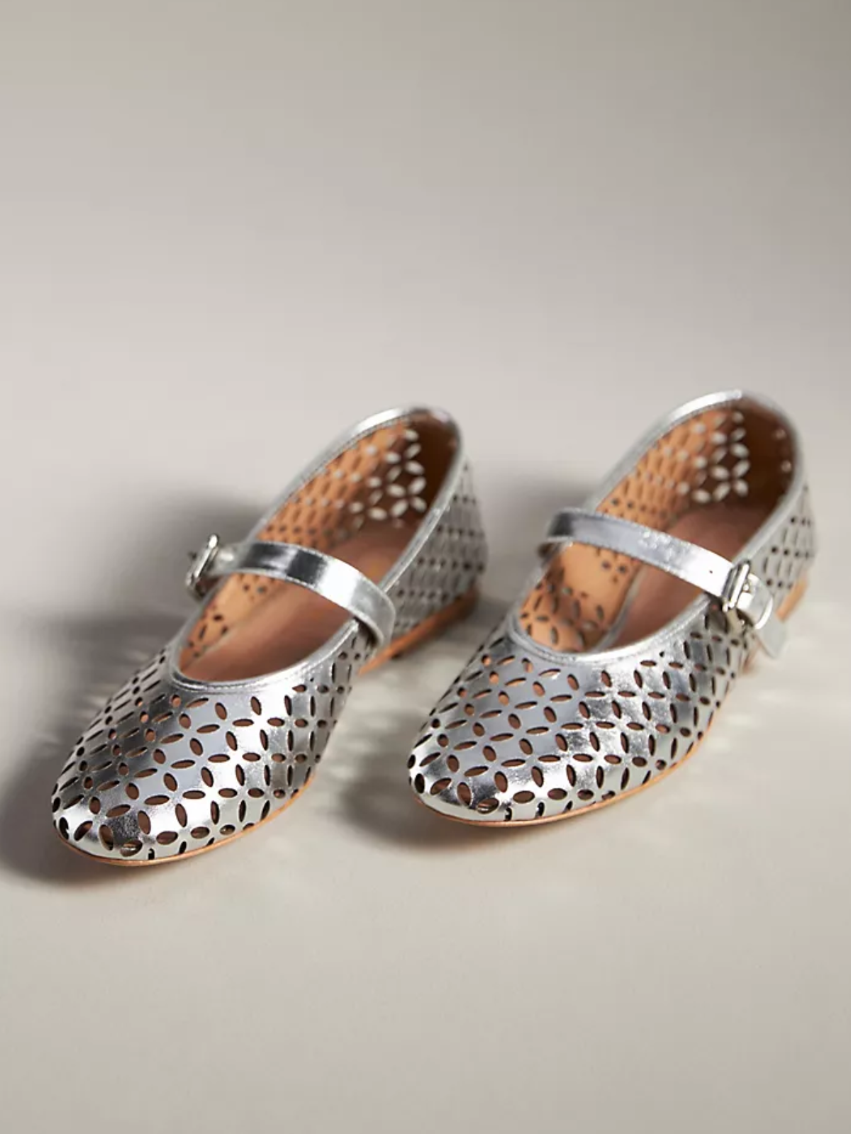 Metallic Silver Flats Mary Janes With Floral Cutout And Buckled Strap