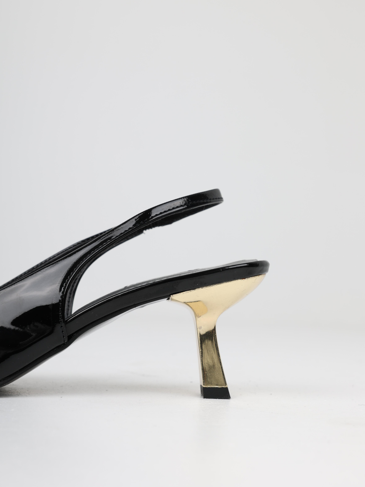 Black Patent Pointy Slingback Pumps With Sculptural Gold Kitten Heels