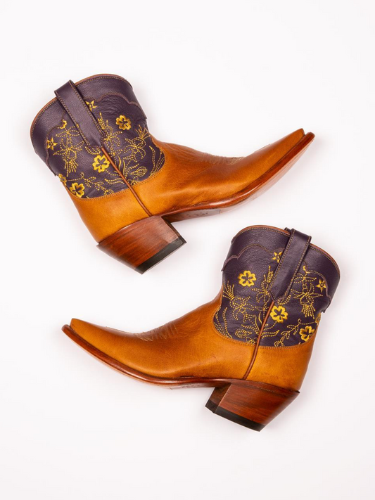 Contrast Tawny And Black Snip-Toe Cowgirl Ankle Booties With Floral Embroidery