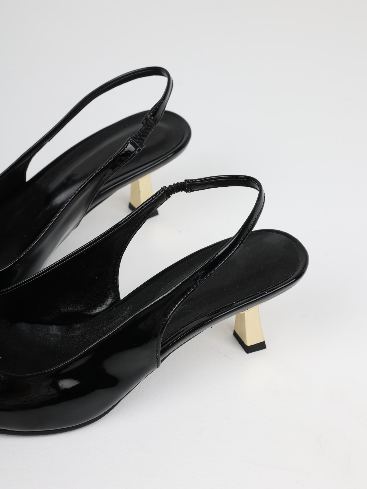 Black Patent Pointy Slingback Pumps With Sculptural Gold Kitten Heels